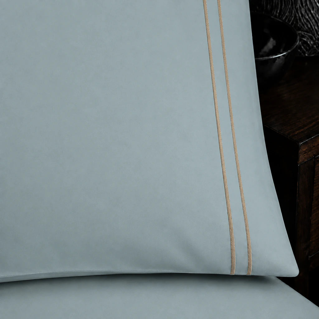 Close-up of duck egg pillowcase with two row stone satin stitch border by Linen and Co