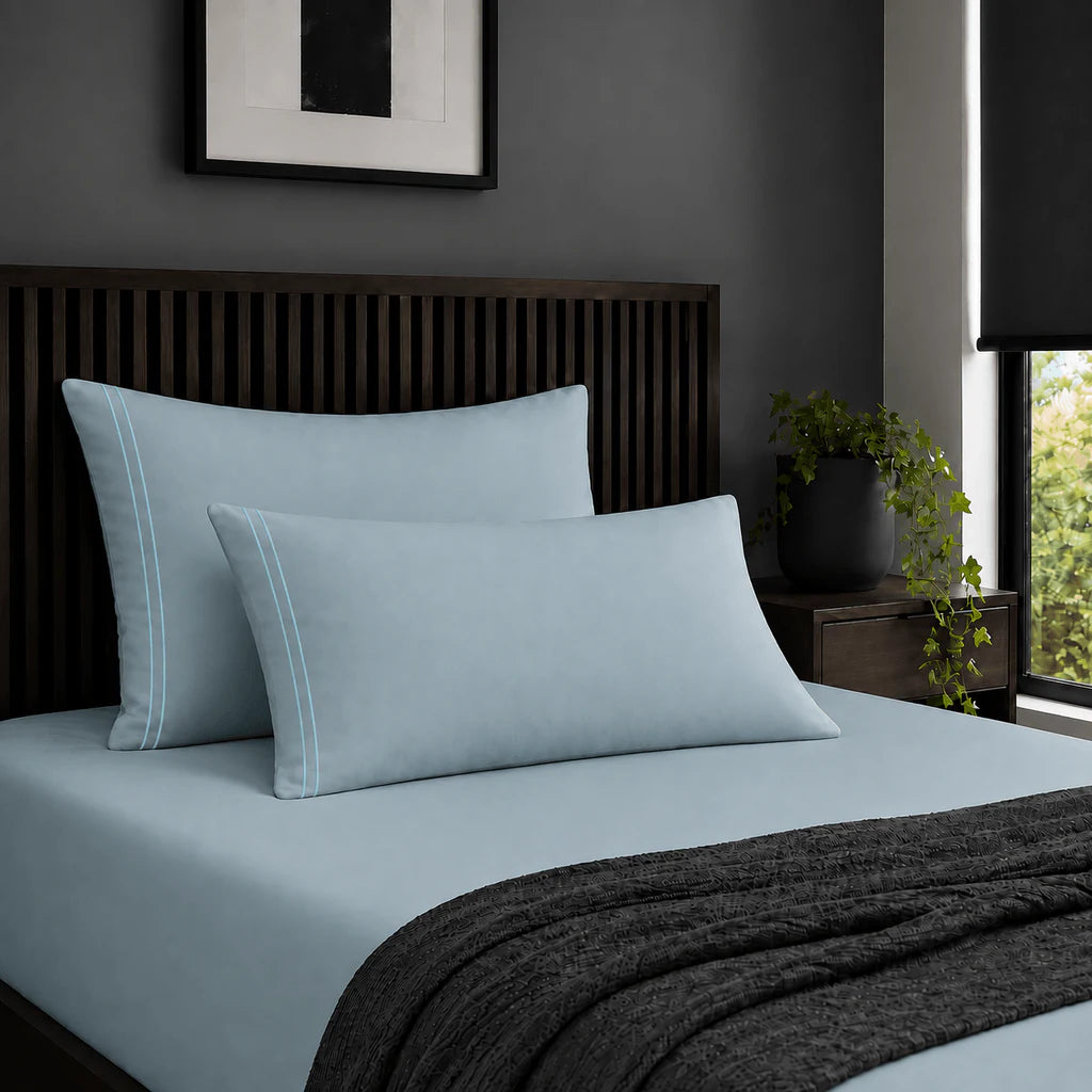 Plain duck egg 200TC 100% cotton percale pillowcases with two row duck egg satin stitch border by Linen and Co