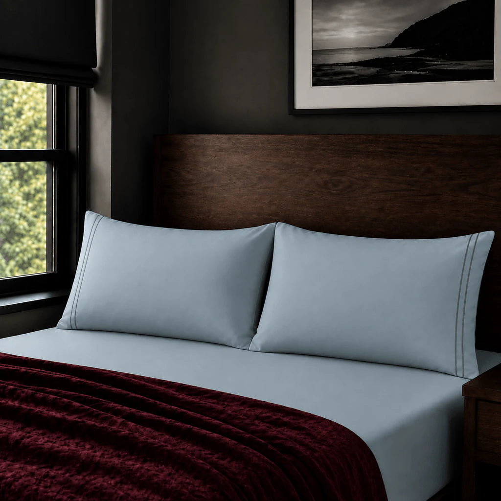 Plain duck egg 200TC polycotton percale pillowcases with two row grey satin stitch border by Linen and Co