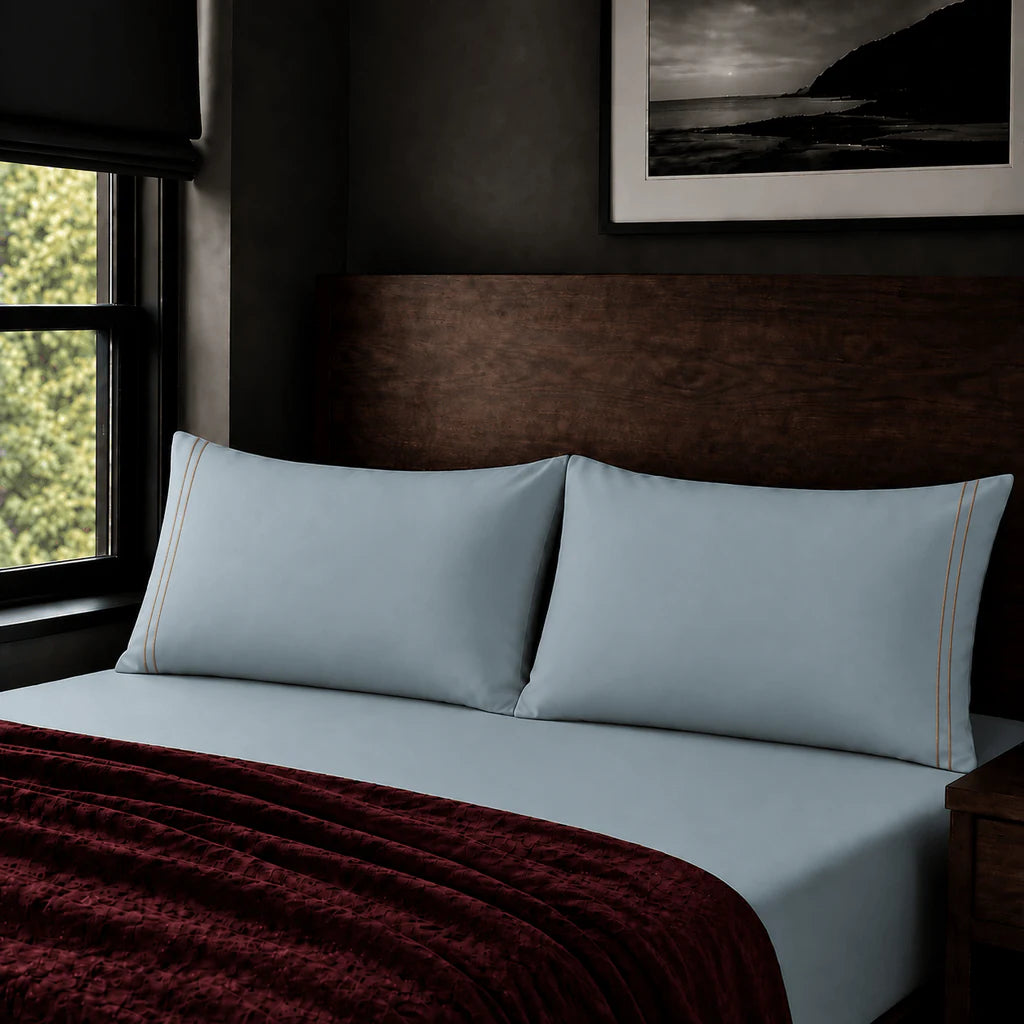 Plain duck egg 200TC polycotton percale pillowcases with two row stone satin stitch border by Linen and Co