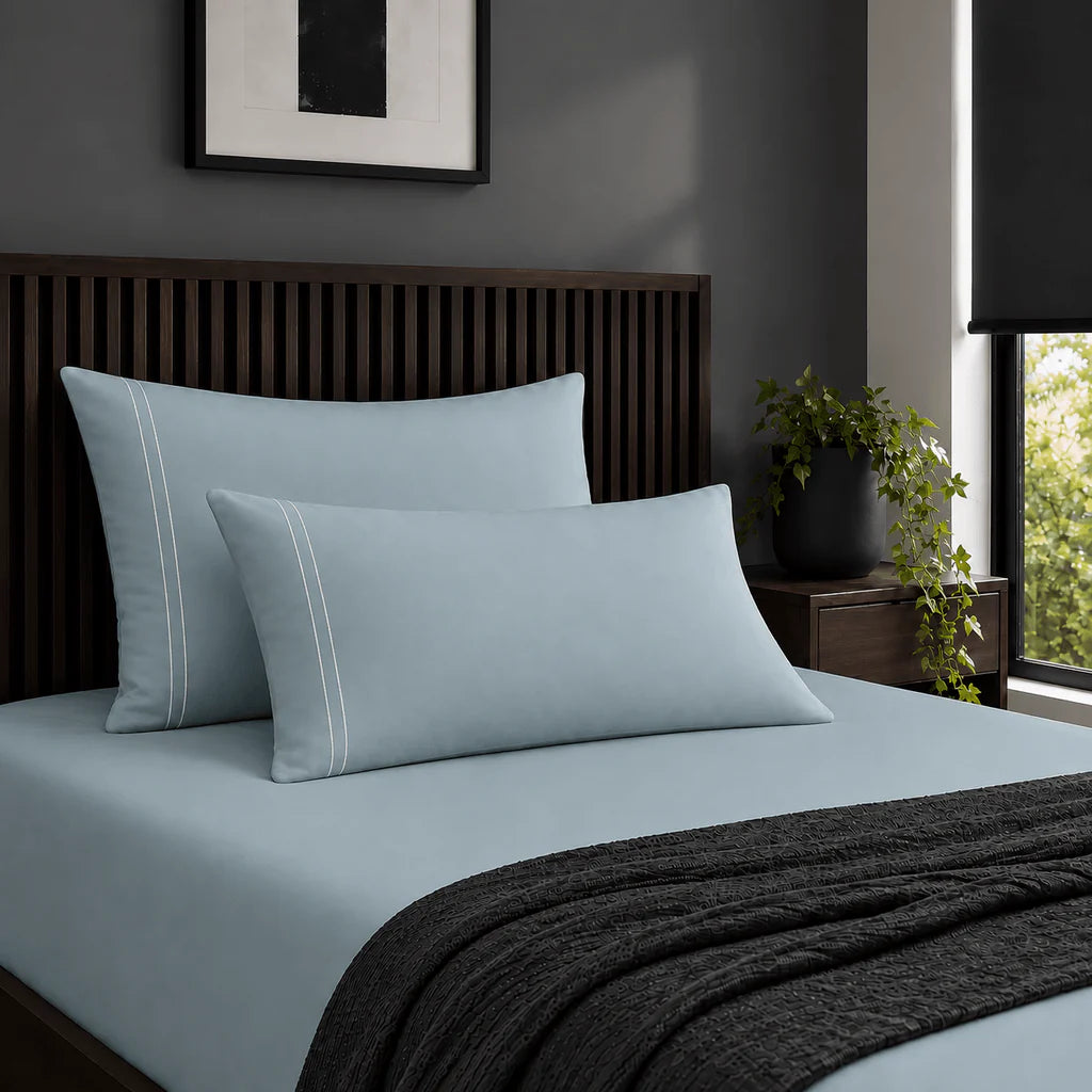Plain duck egg 200TC 100% cotton percale pillowcases with two row white satin stitch border by Linen and Co