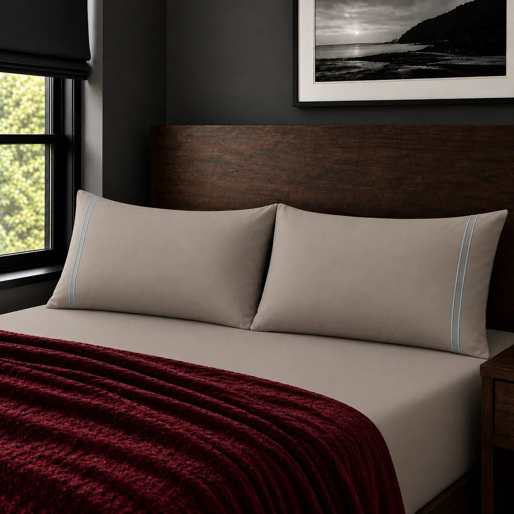 Plain stone 200TC polycotton percale pillowcases with two row duck egg satin stitch border by Linen and Co