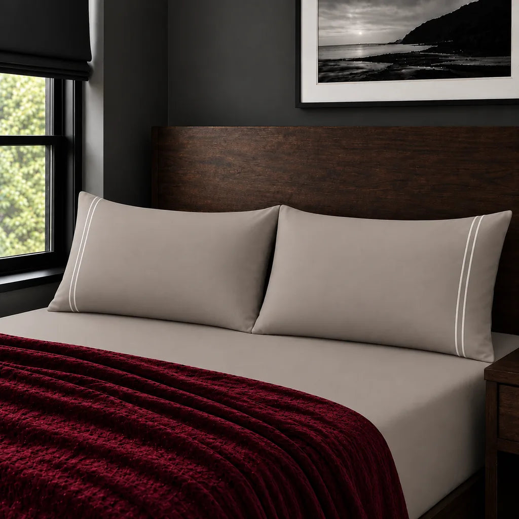 Plain stone 200TC polycotton percale pillowcases with two row white satin stitch border by Linen and Co