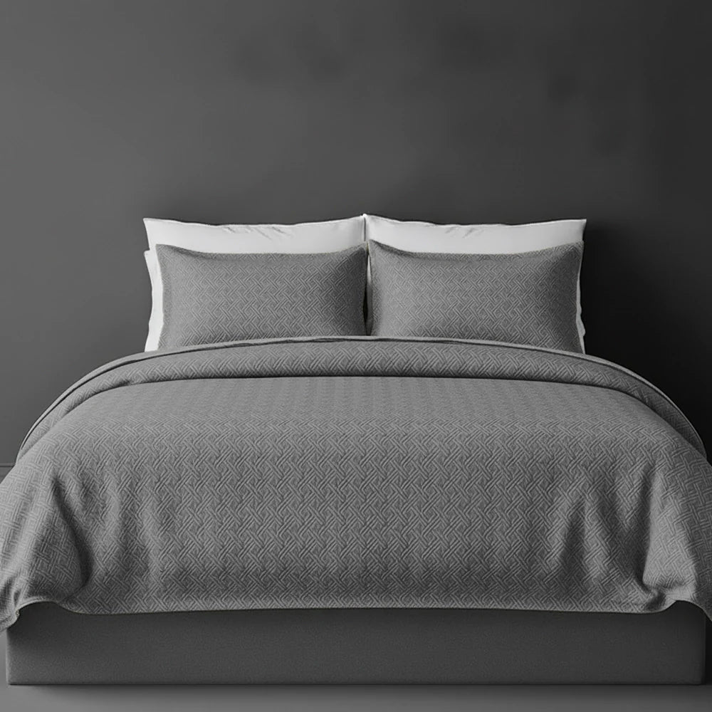 Platinum Grey Rome bedspread on bed by Linen and Co - luxury hospitality bedspread with textured finish