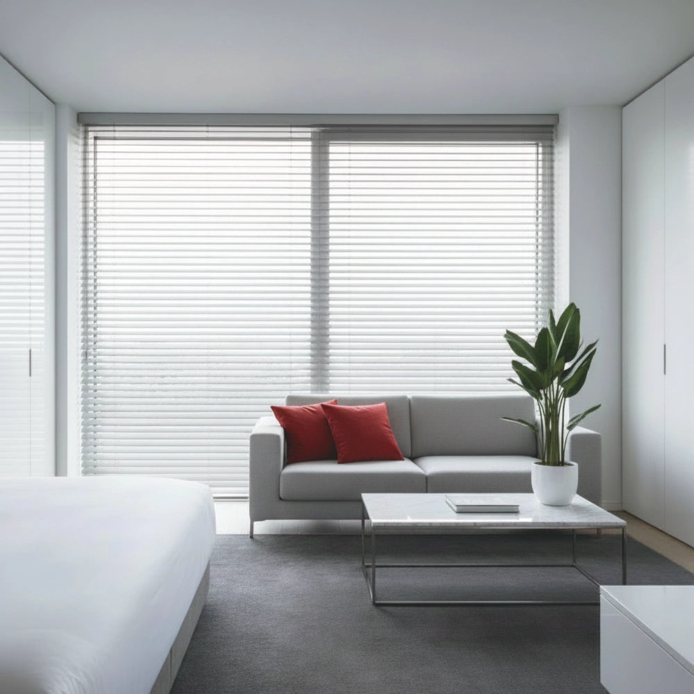 Silver aluminium Venetian blinds in a modern bedroom by Linen and Co - premium hospitality window blinds for hotels and guest houses