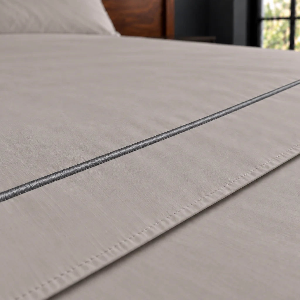 stone cotton percale 200tc flat sheet, one row grey satin stitch — close up — Linen and Co