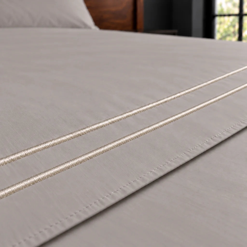 stone cotton percale 200tc flat sheet, two row cream satin stitch — close up — Linen and Co