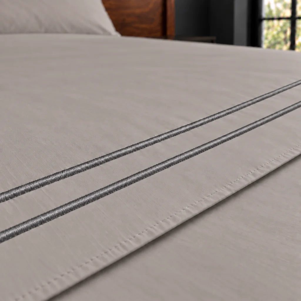 stone cotton percale 200tc flat sheet, two row grey satin stitch — close up — Linen and Co