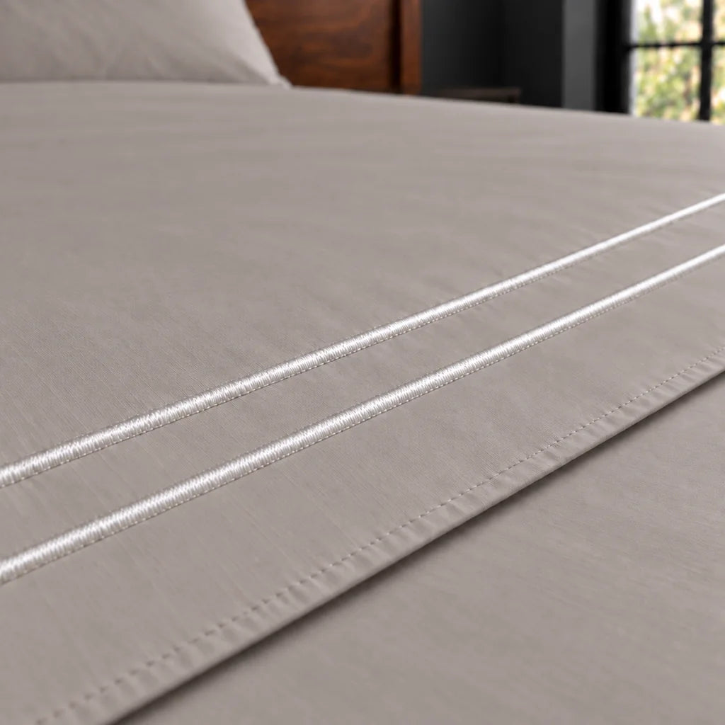 stone cotton percale 200tc flat sheet, two row white satin stitch — close up — Linen and Co