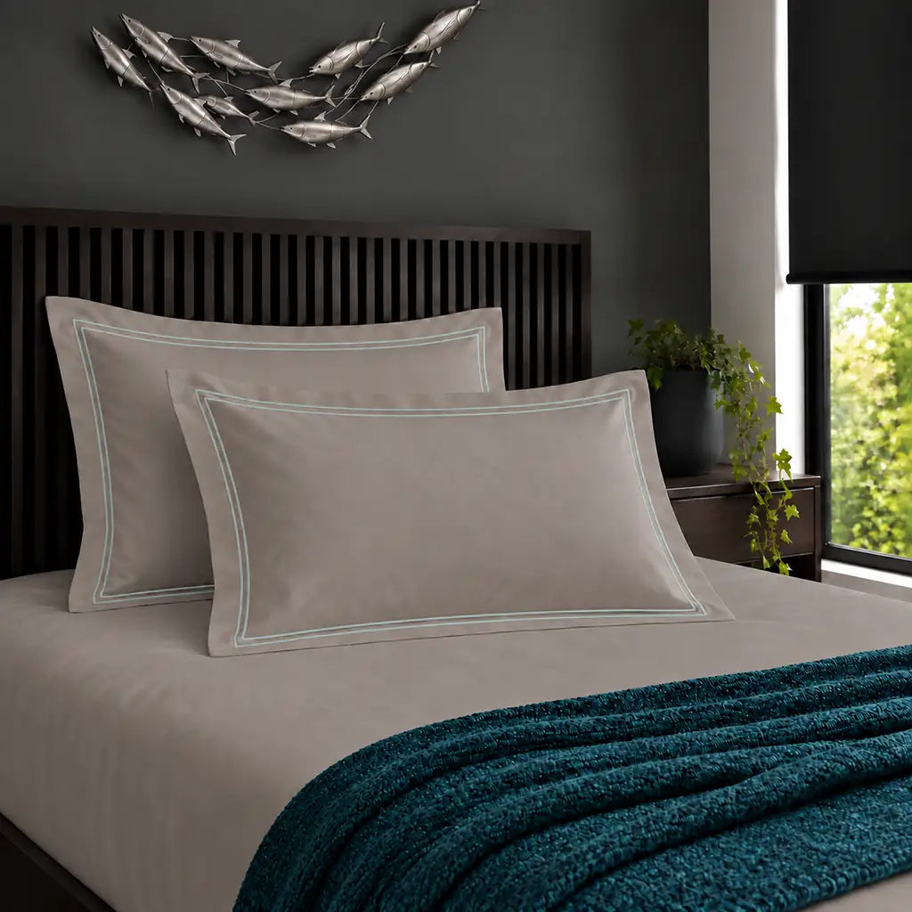 Oxford stone 200TC cotton percale pillowcases with two row duck egg satin stitch border by Linen and Co