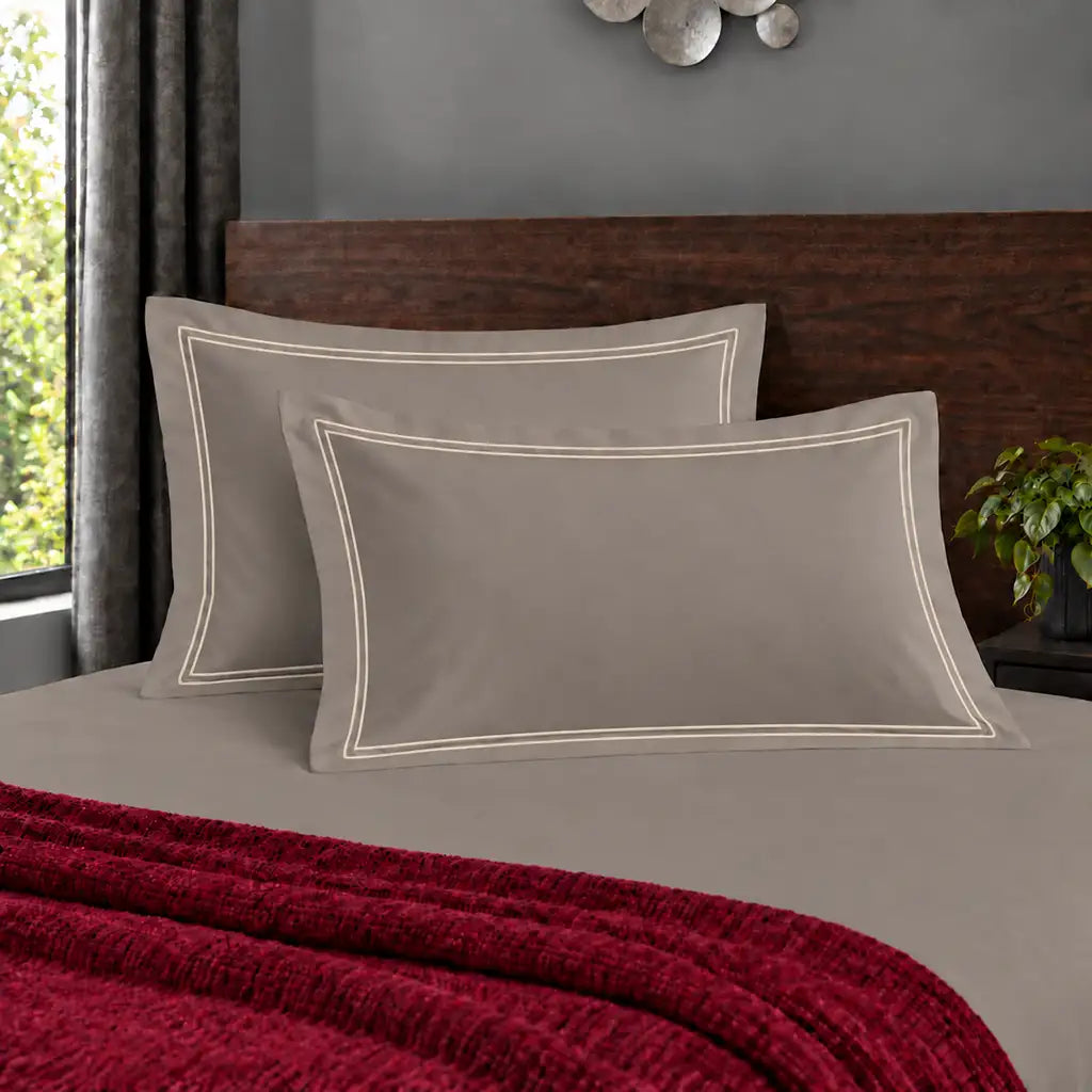 Oxford stone 200TC polycotton percale pillowcases with two row cream satin stitch border by Linen and Co