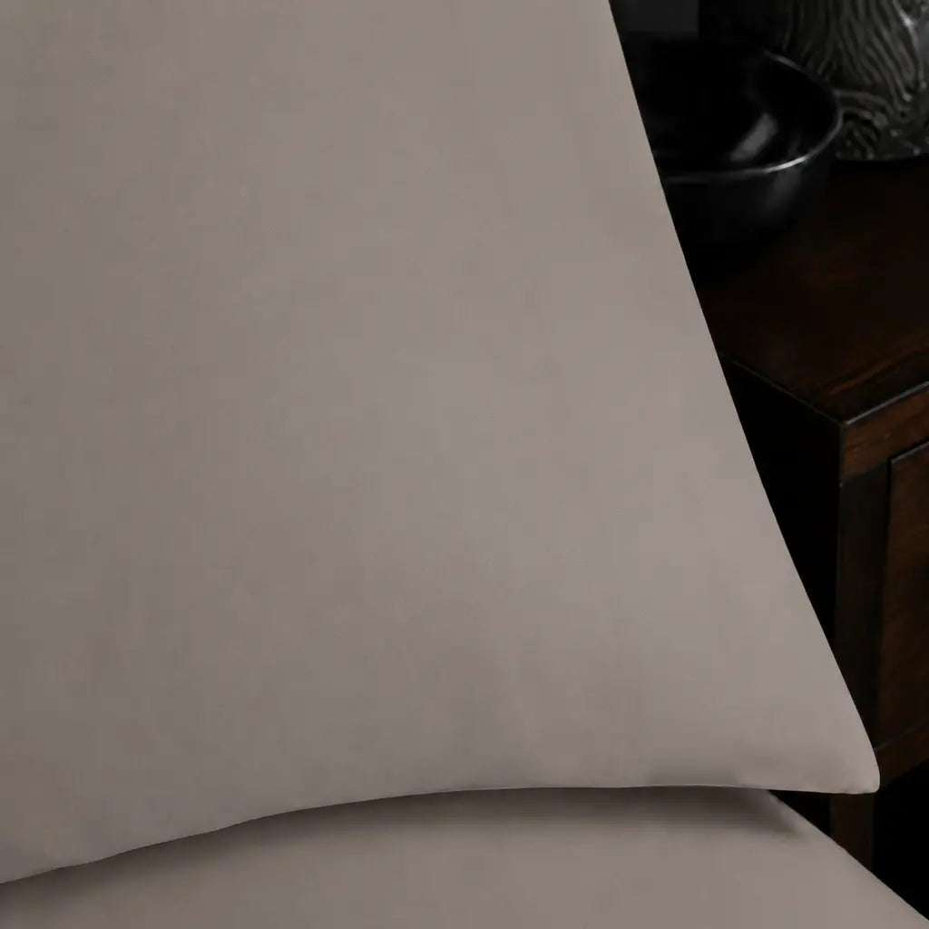 Close-up of the plain no satin stitch finished edge on a Stone Polycotton Percale 200TC pillowcase.