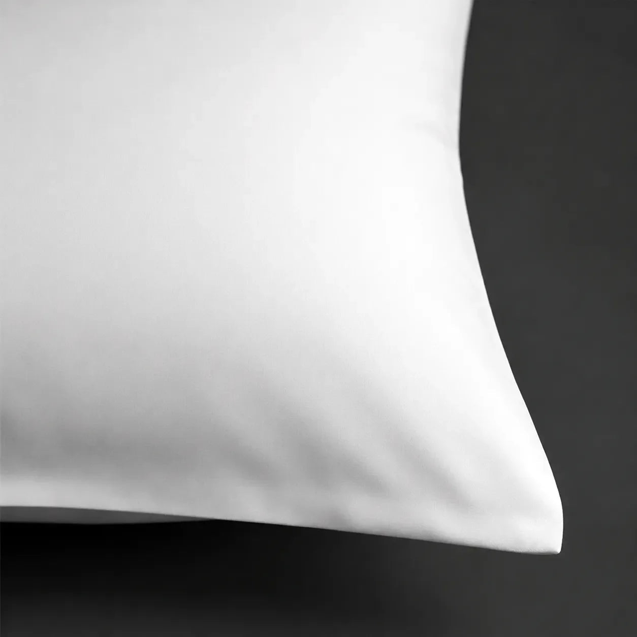 Close-up of White 100% Cotton Percale 200TC pillow case with a plain no satin stitch finished edge - Linen and Co