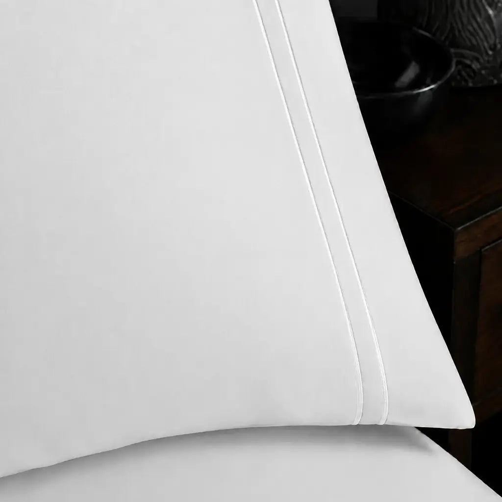 Close-up of White 100% Cotton Percale 200TC pillow case with White two-row satin stitch - Linen and Co