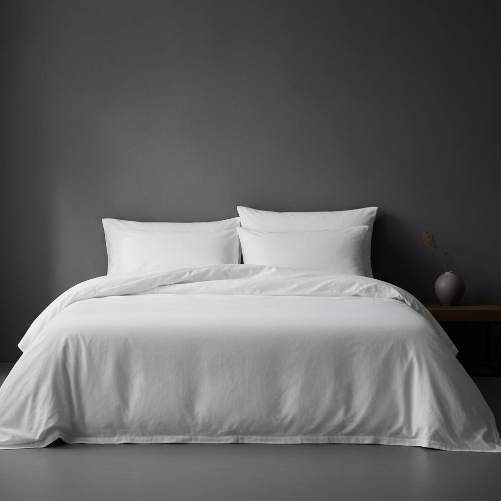 White bed linen with pillows and duvet on bed by Linen and Co - custom sizing guide for luxury bedding