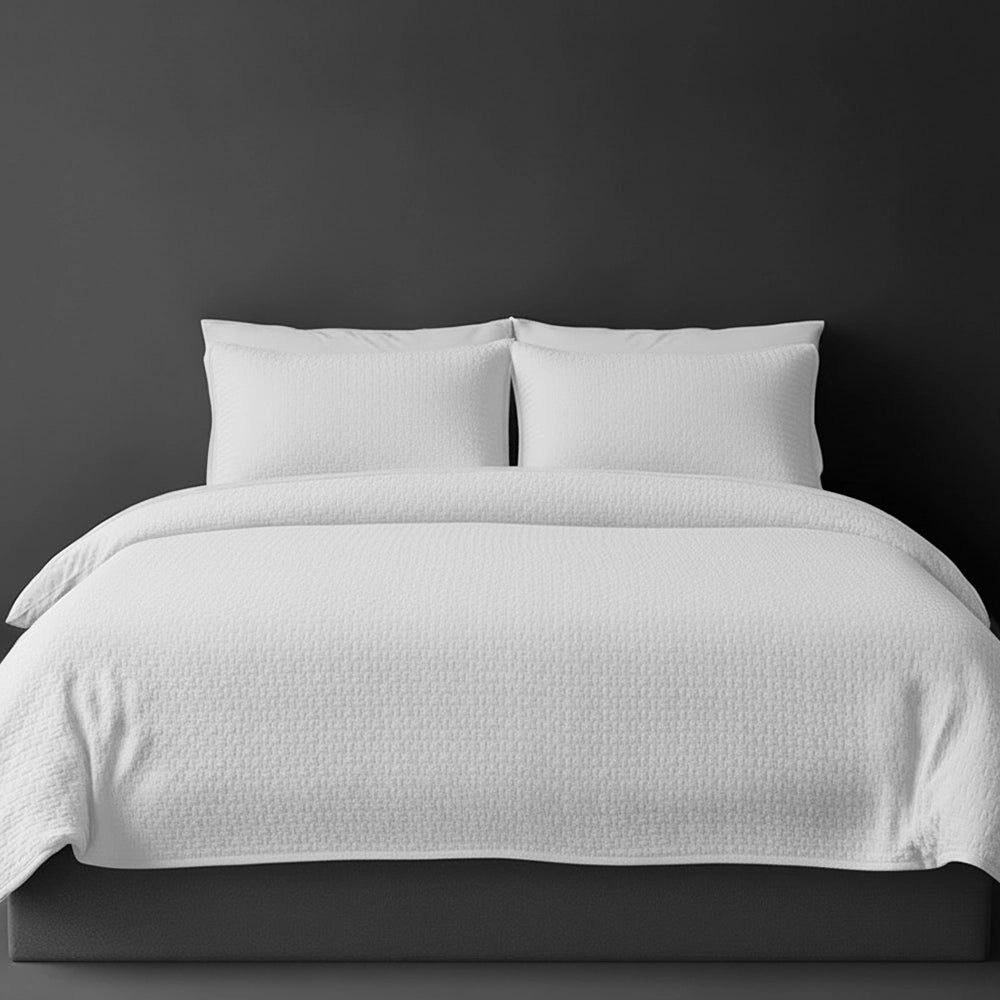 White Berlin bedspread on bed by Linen and Co - luxury hospitality bedspread with textured finish