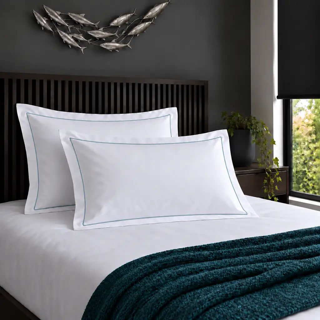 Oxford white 200TC 100% cotton percale pillowcases with one row duck egg satin stitch border by Linen and Co