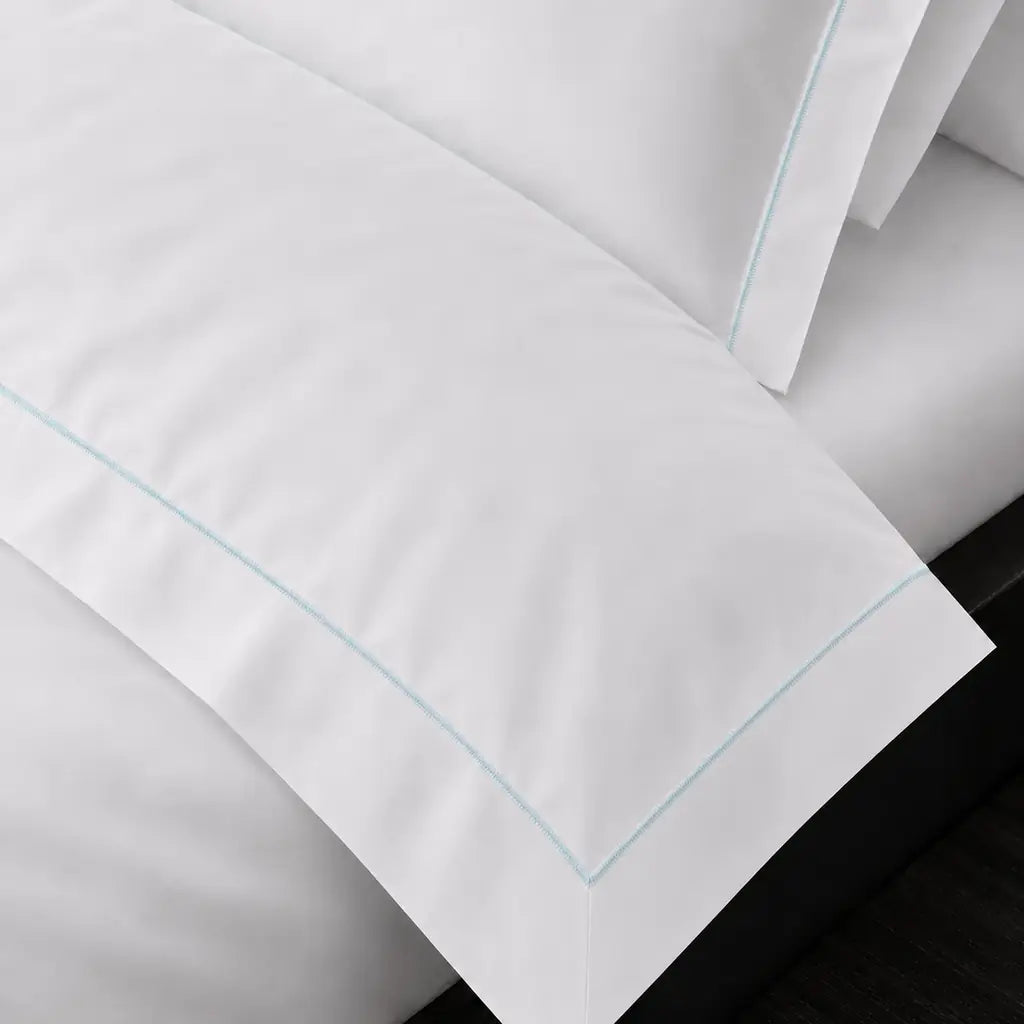 White Cotton 300TC Oxford duvet cover set with one row duck egg satin stitch — on-bed detail — Linen & Co