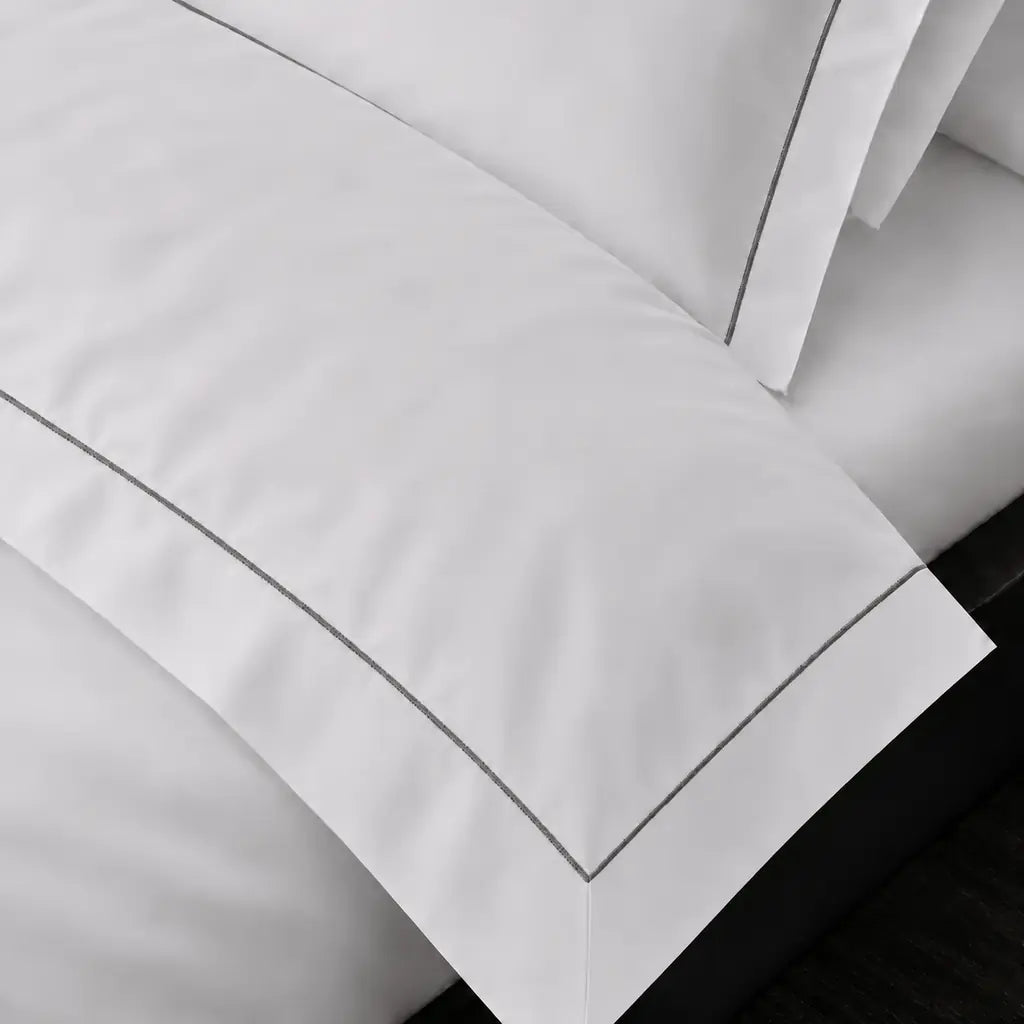 White Cotton 300TC Oxford duvet cover set with one row grey satin stitch — on-bed detail — Linen & Co