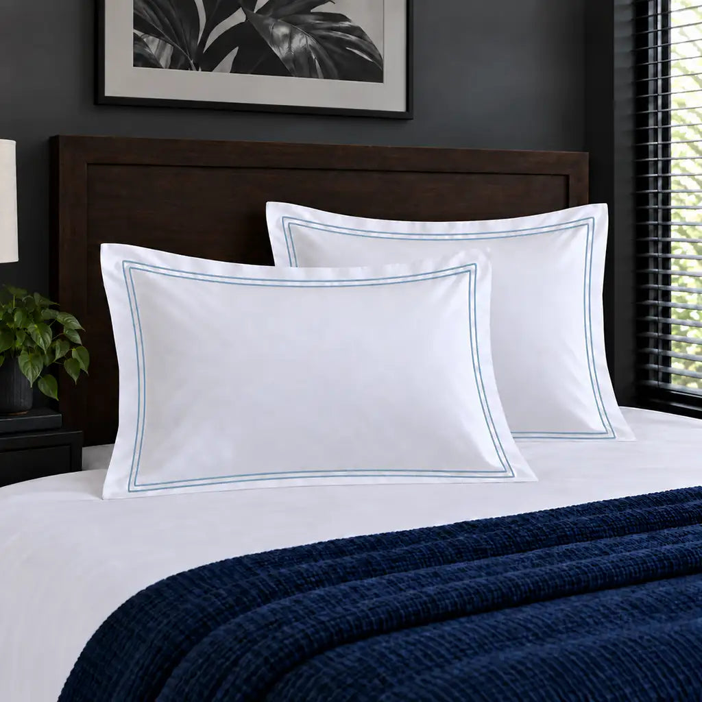 Oxford white 300TC 100% cotton percale pillowcases with two row duck egg satin stitch border by Linen and Co