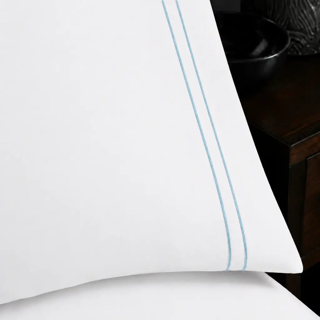 Close-up of White Polycotton Percale 200TC pillow case with Duck Egg two-row satin stitch - Linen and Co