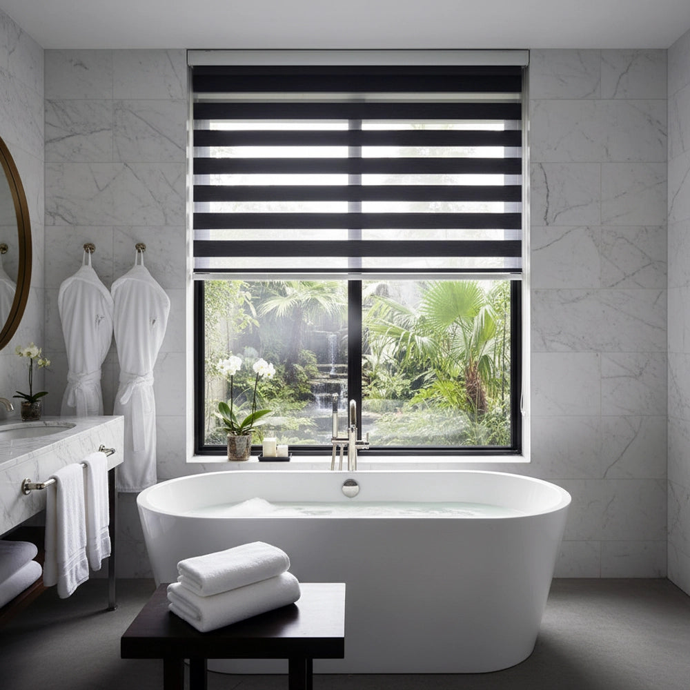 Luxury hotel bathroom with white towels and bath robes by Linen and Co, featuring modern fixtures and natural light