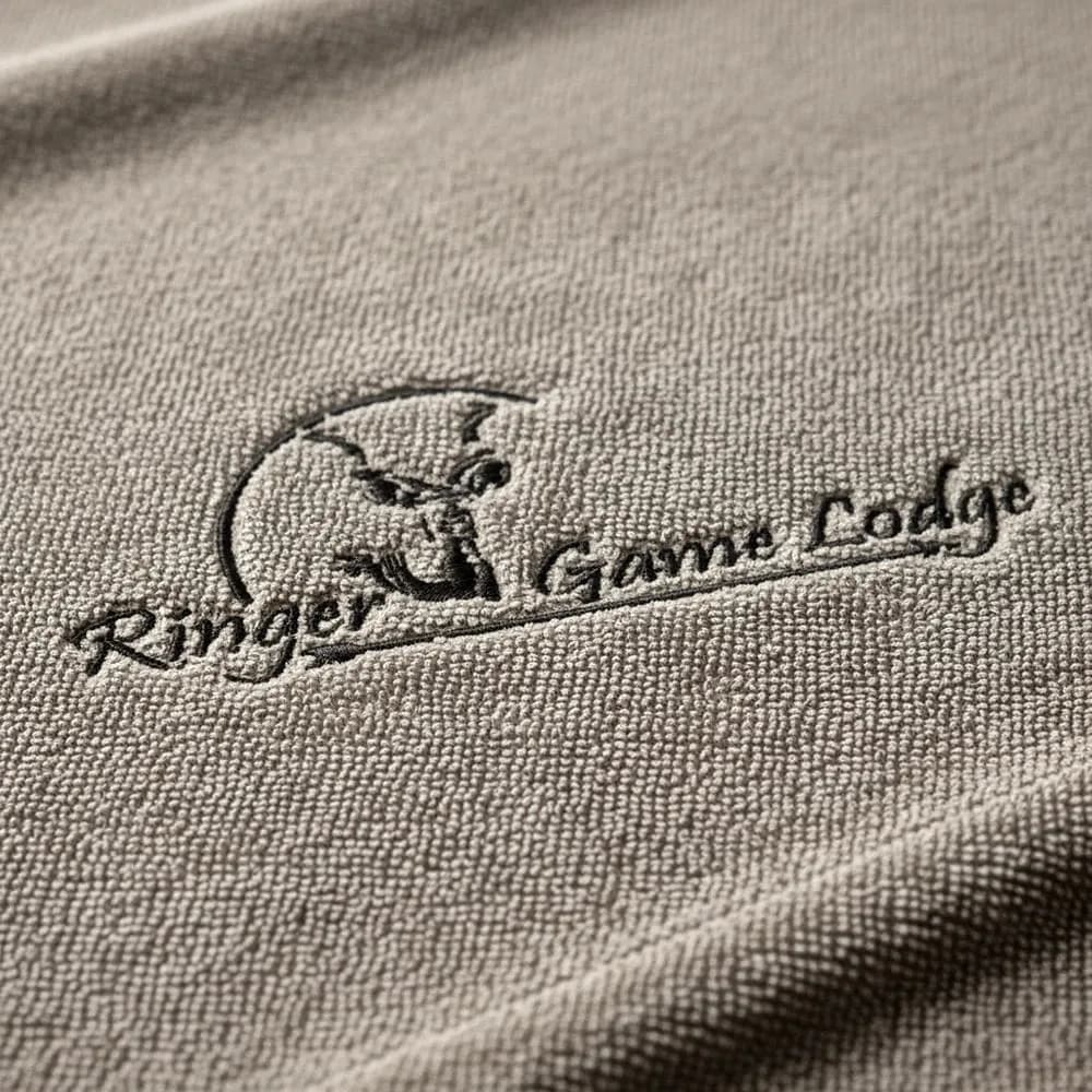 Ringer Game Lodge logo embroidered tone on tone on stone towelling by Linen and Co