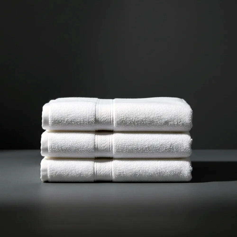 Three folded white towels