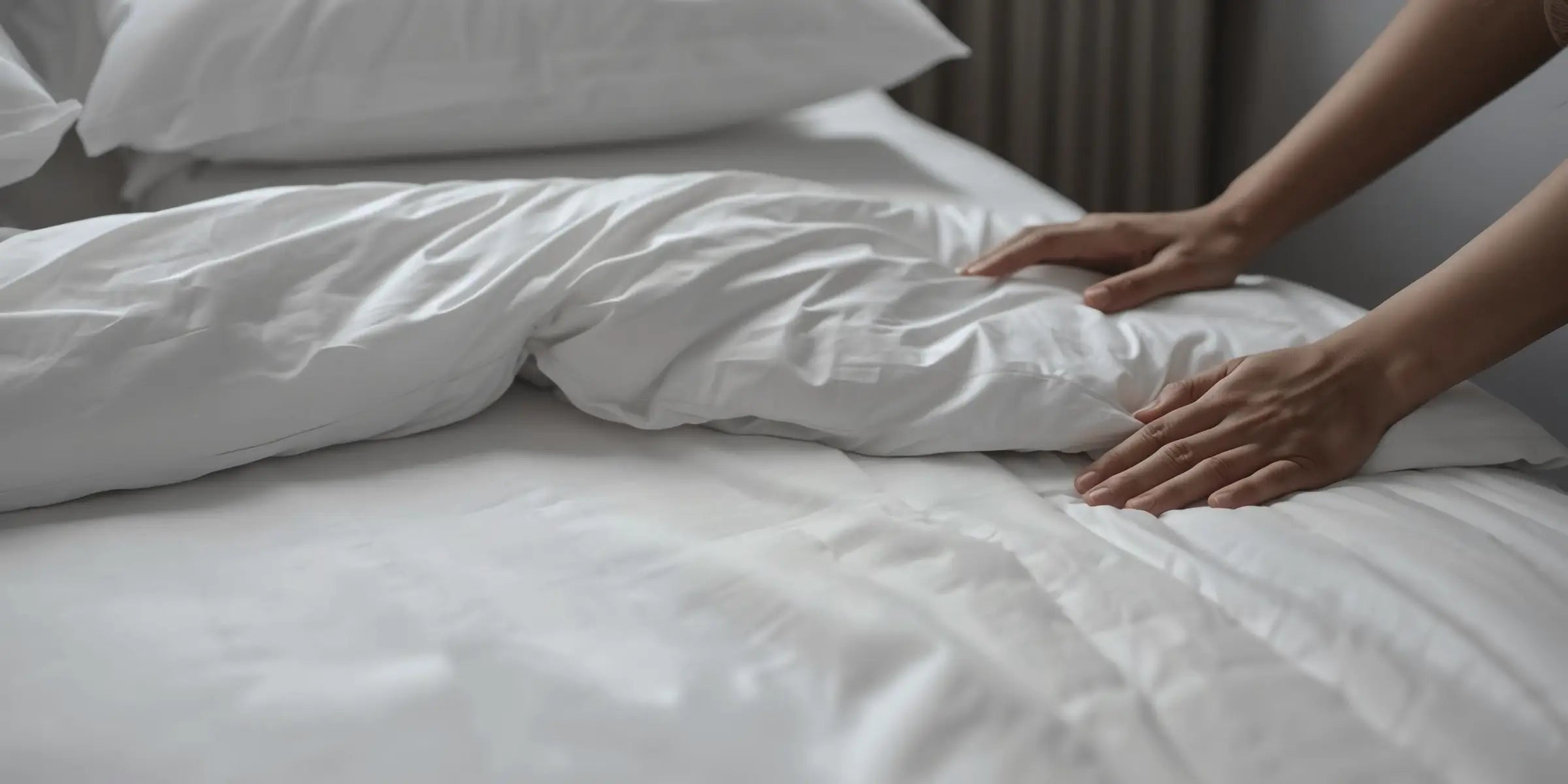 Guest-ready white bed linen for a hospitality room by Linen and Co