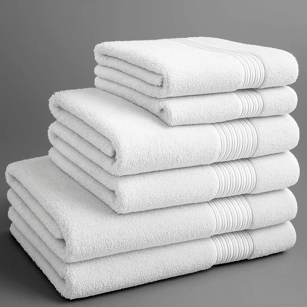 Towels neatly folded in piles of assorted colours