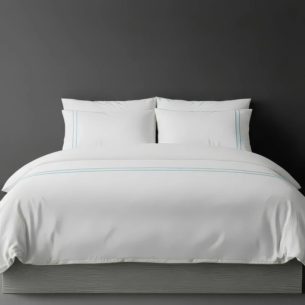 Linen & Co white duvet cover with two thin duck egg satin stitch lines, luxury hotel bedding detail