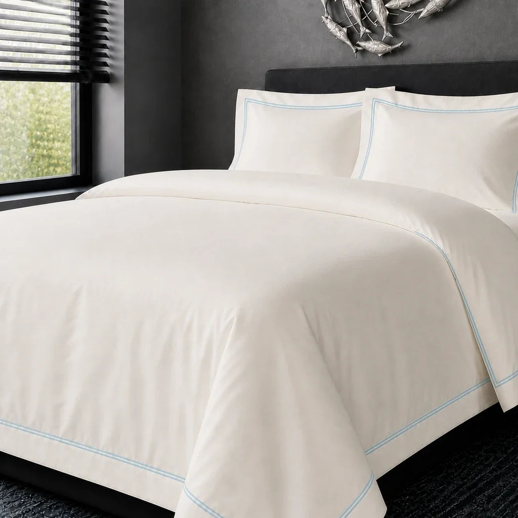 Cream cotton 200TC Oxford duvet cover set with duck egg two-row satin stitch – hero view | Linen & Co