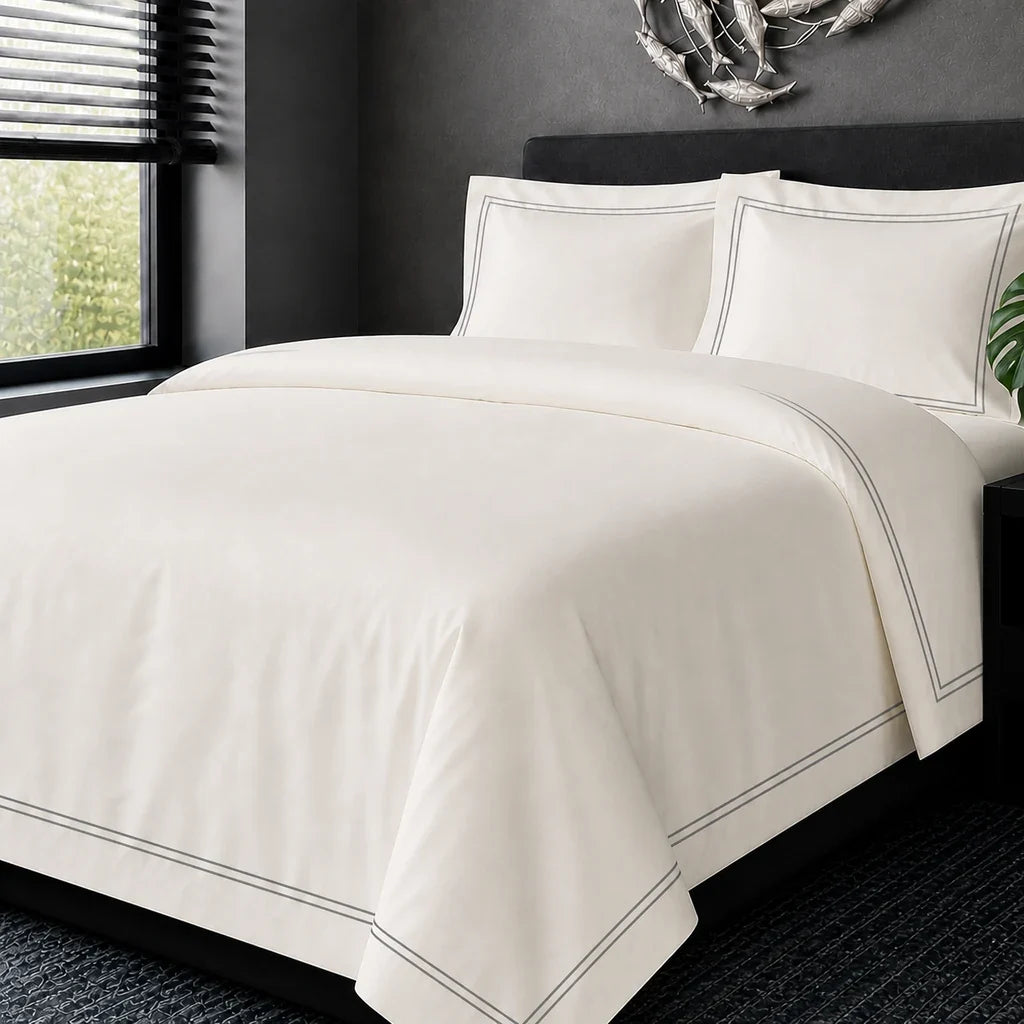 Cream cotton 200TC Oxford duvet cover set with grey two-row satin stitch – hero view | Linen & Co