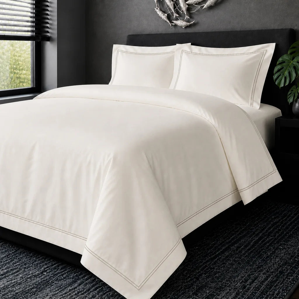 Cream cotton 200TC Oxford duvet cover set with stone two-row satin stitch – hero view | Linen & Co