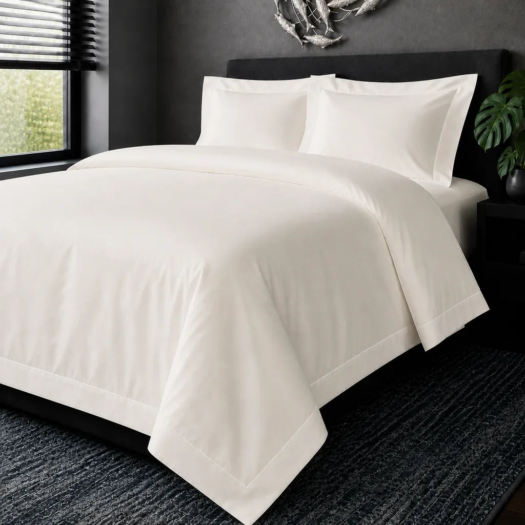 Cream cotton 200TC Oxford duvet cover set with white one-row satin stitch – hero view | Linen & Co