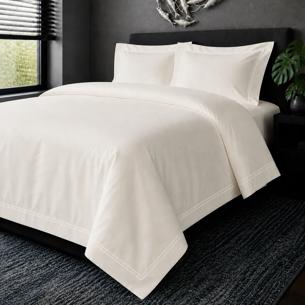Cream cotton 200TC Oxford duvet cover set with white two-row satin stitch – hero view | Linen & Co