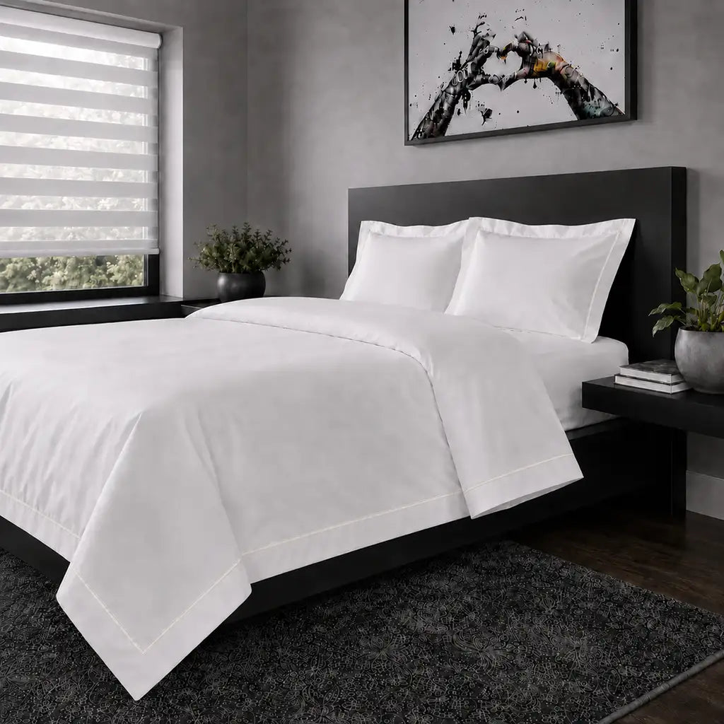 White polycotton percale Oxford duvet cover set with cream one-row satin stitch – hero view | Linen & Co
