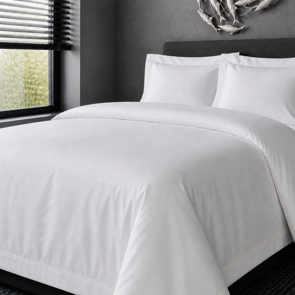 White cotton 200TC Oxford duvet cover set with cream two-row satin stitch – hero view | Linen & Co