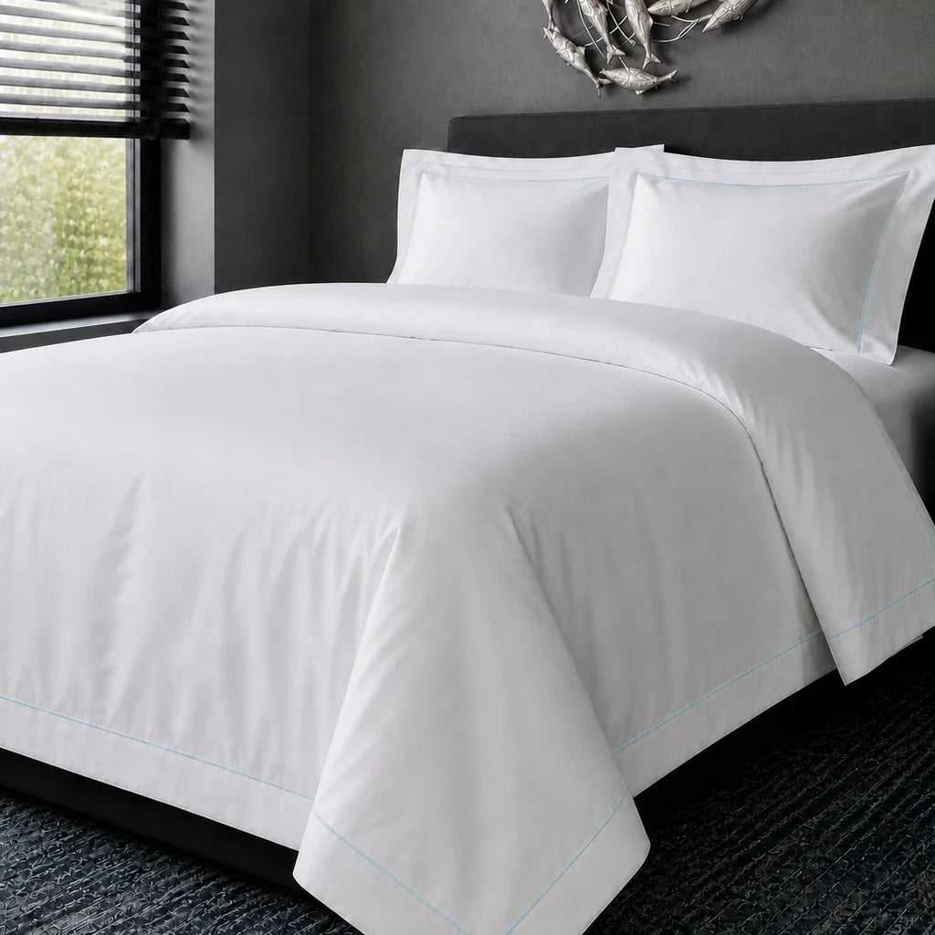 White cotton 200TC Oxford duvet cover set with duck egg one-row satin stitch – hero view | Linen & Co