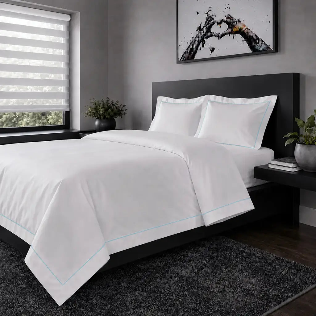 White polycotton percale Oxford duvet cover set with duck egg one-row satin stitch – hero view | Linen & Co