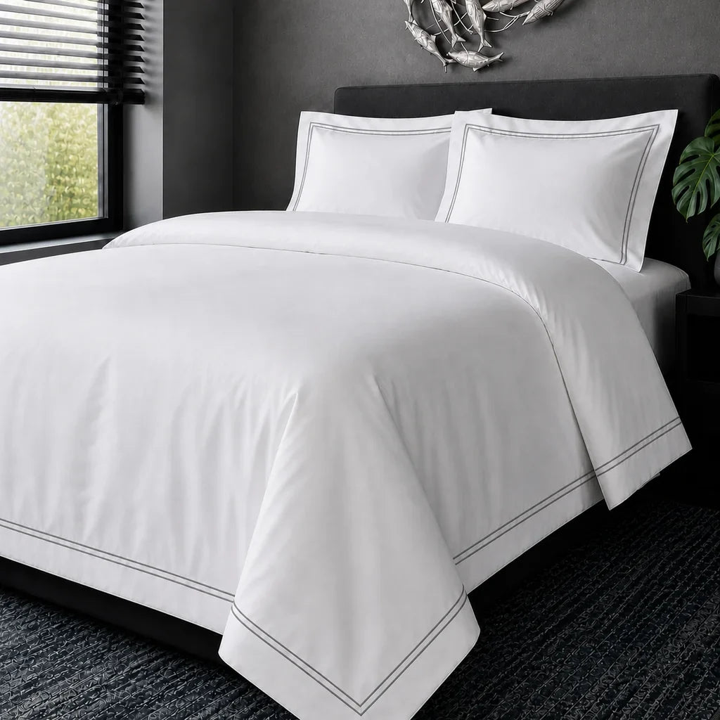 White cotton 200TC Oxford duvet cover set with grey two-row satin stitch – hero view | Linen & Co