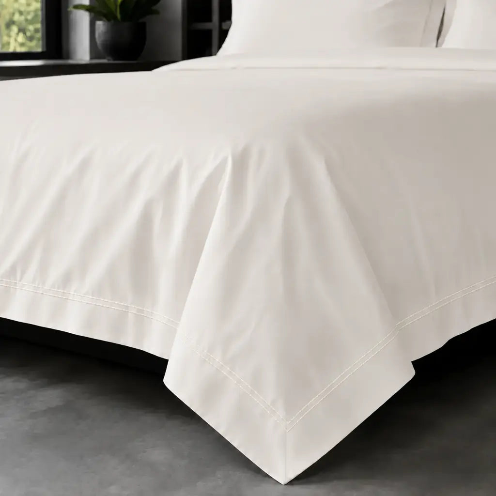 Cream polycotton percale 200TC Oxford duvet cover on bed with cream two-row satin stitch - Linen and Co
