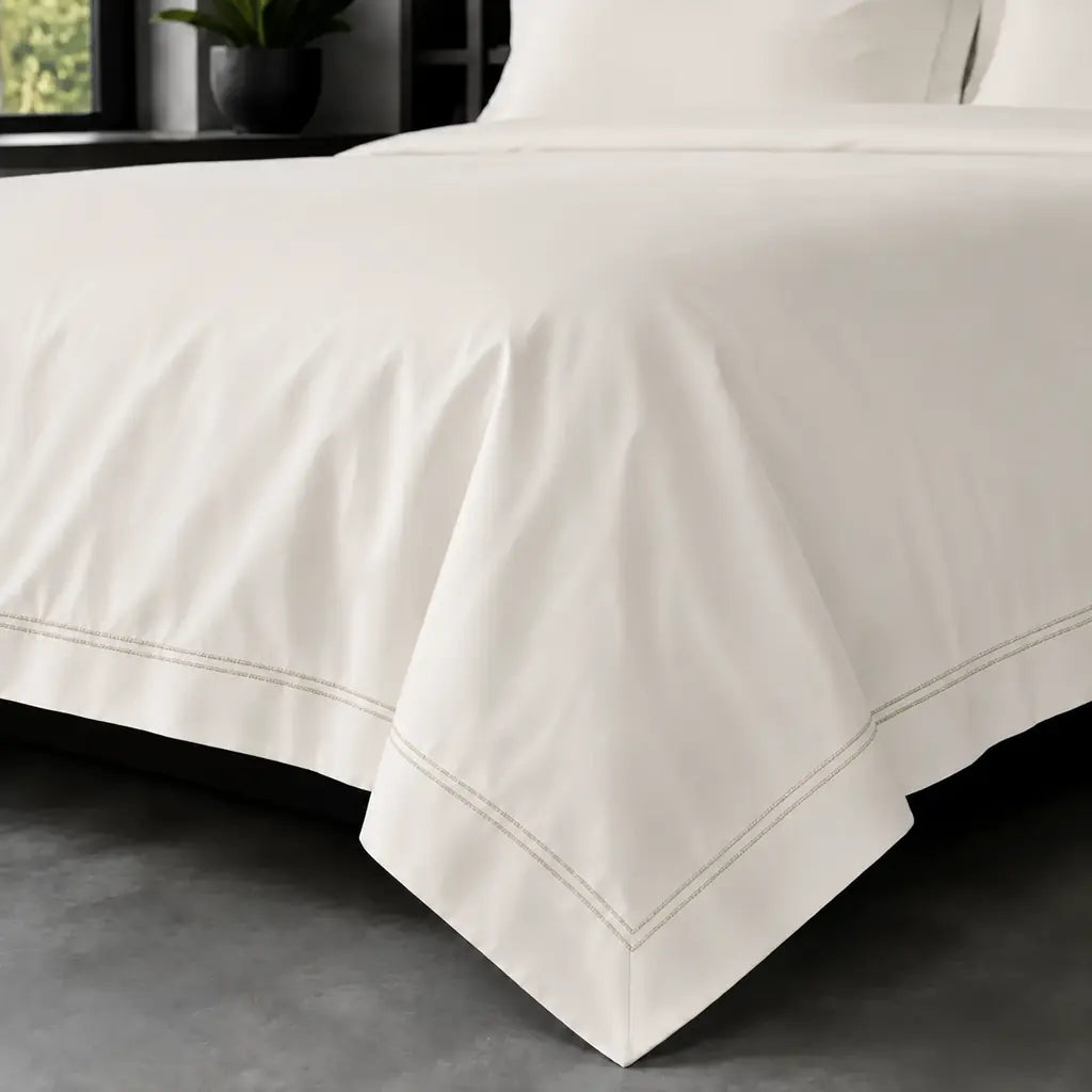 Cream polycotton percale 200TC Oxford duvet cover on bed with Stone two-row satin stitch - Linen and Co