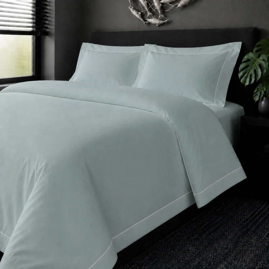 Duck Egg cotton 200TC Oxford duvet cover set with cream one-row satin stitch – on the bed view | Linen & Co