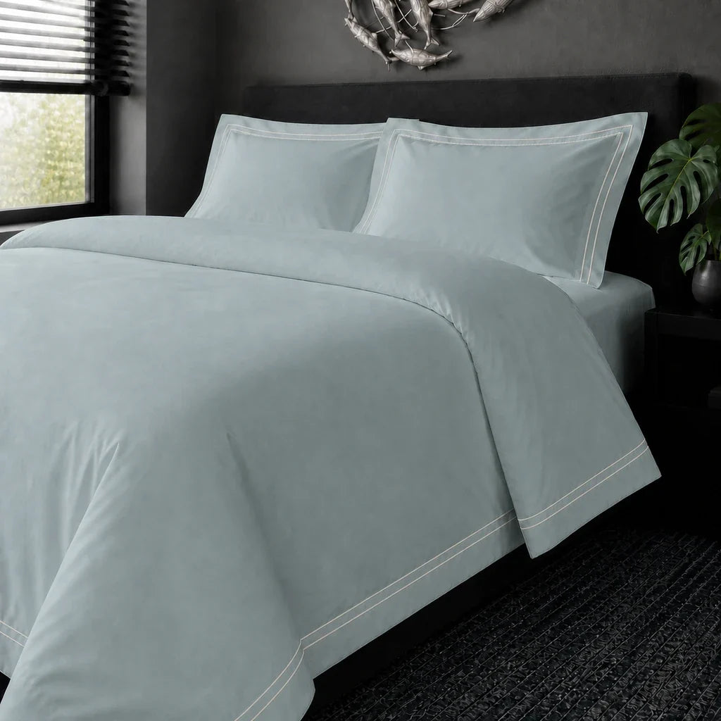 Duck Egg cotton 200TC Oxford duvet cover set with cream two-row satin stitch – on the bed view | Linen & Co