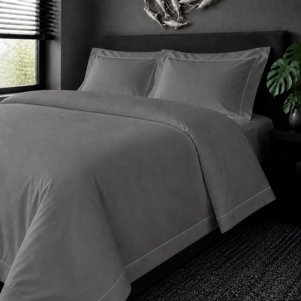Grey cotton 200TC Oxford duvet cover set with Duck Egg one-row satin stitch – on the bed view | Linen & Co