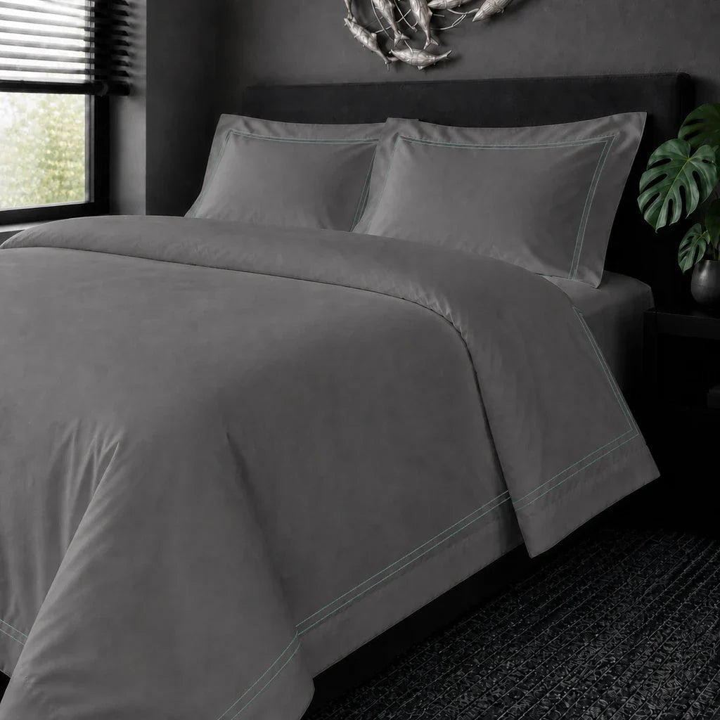 Grey cotton 200TC Oxford duvet cover set with Duck Egg two-row satin stitch – on the bed view | Linen & Co