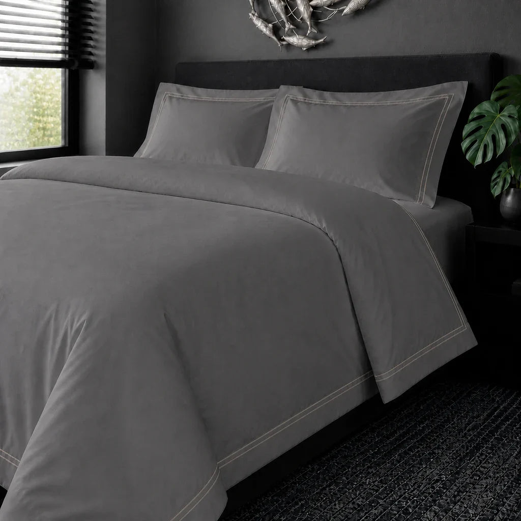 Grey cotton 200TC Oxford duvet cover set with stone two-row satin stitch – on the bed view | Linen & Co