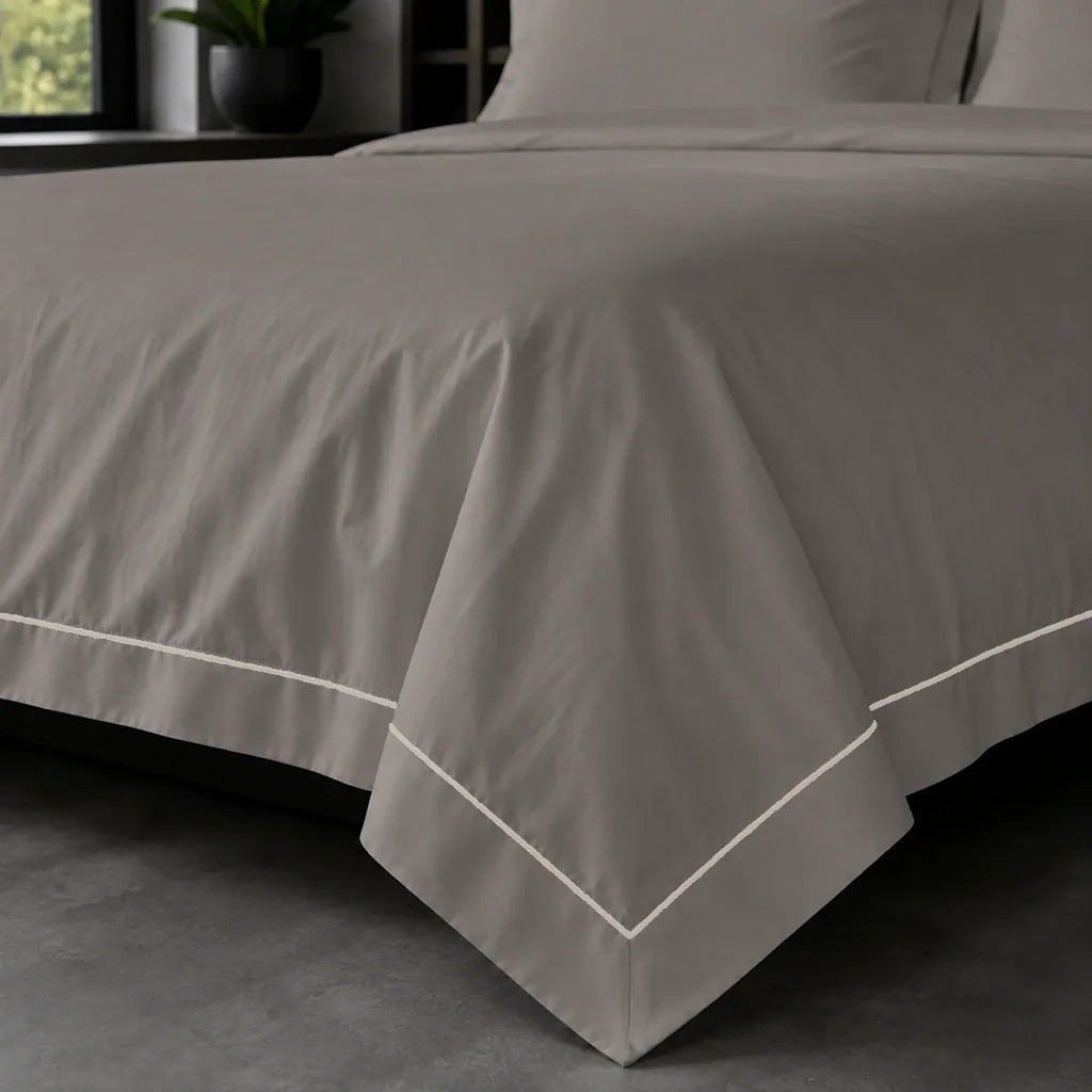 Stone Oxford duvet cover set - Stone One Row Satin Stitch - on-the-bed corner view - Linen and Co