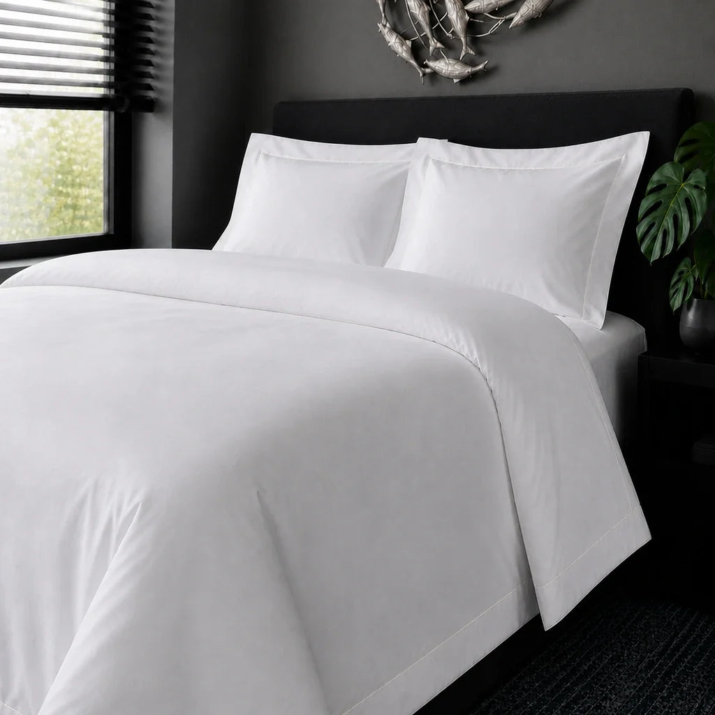 White cotton 200TC Oxford duvet cover set with cream one-row satin stitch – on-bed view | Linen & Co